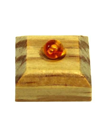 Support Montessori en bois pour isoler une perle dorée